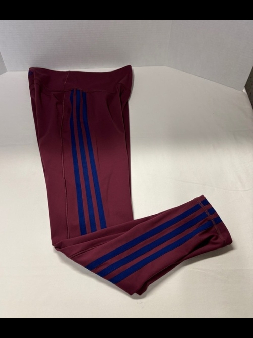 Adidas Kids Maroon Leggings with Blue Side Stripes.